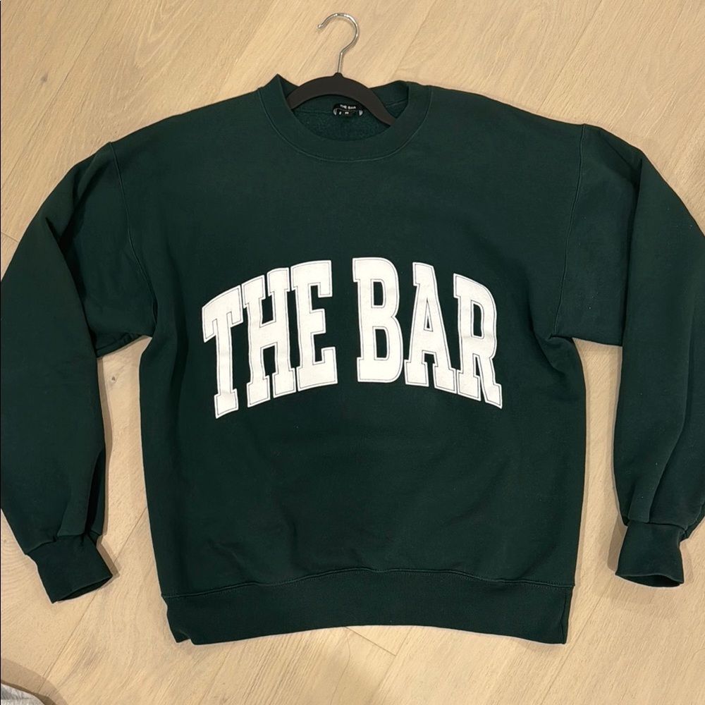 The bar varsity sweatshirt hunter green